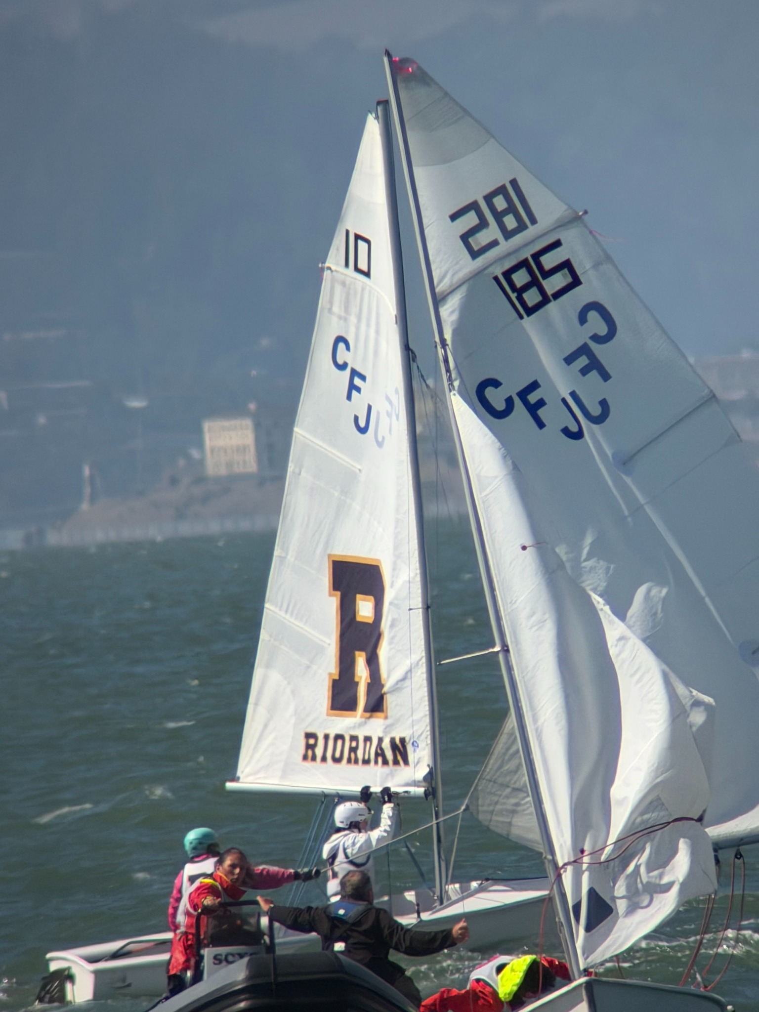 Riordan’s sail among other dinghies and a support boat